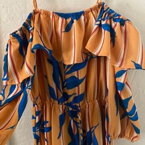 Jealous tomato yellow floral romper. Medium.